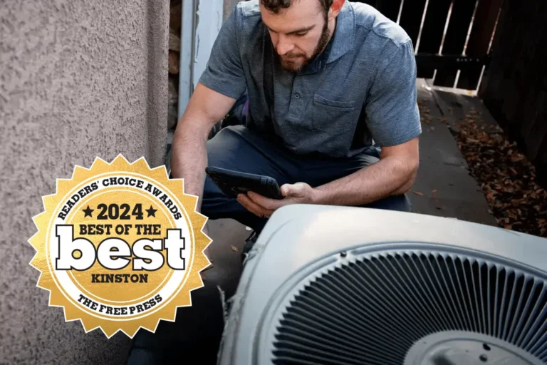 HVAC technician working on unit - Best of Kinston readers choice award